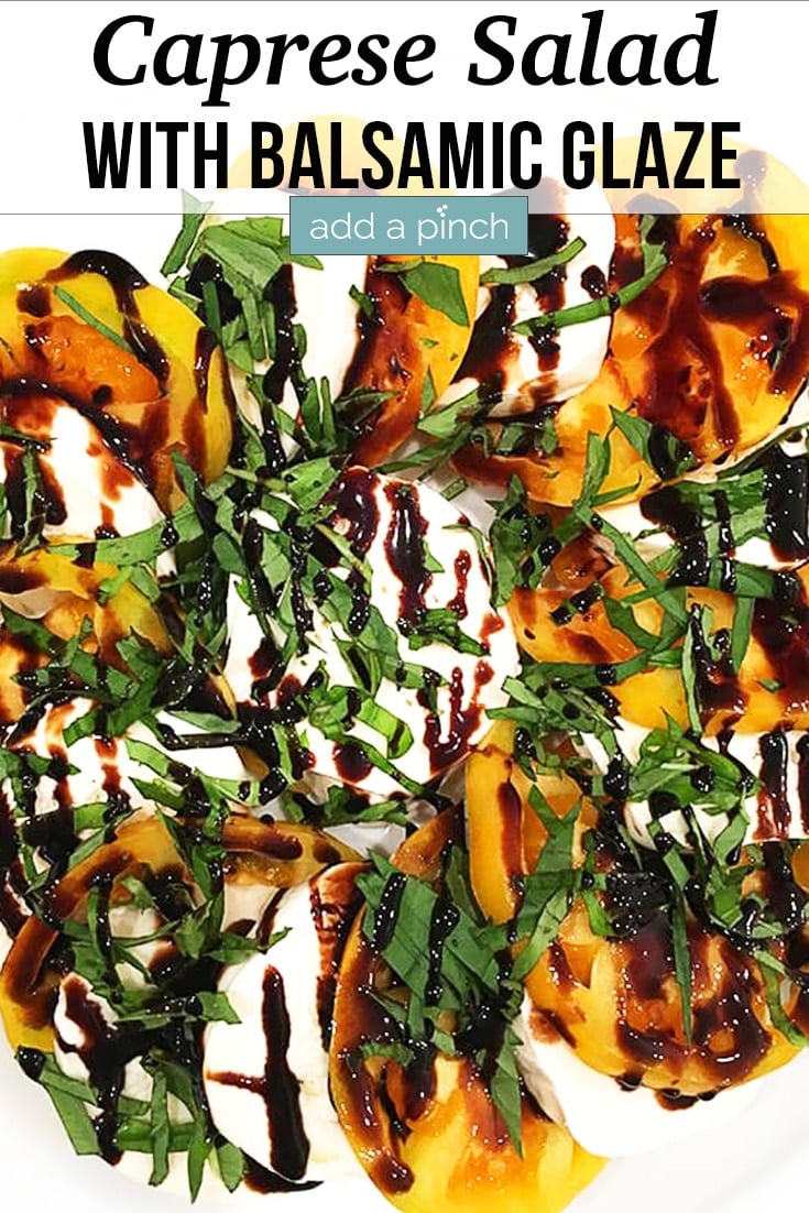 Caprese Salad with heirloom tomatoes, mozzarella slices, basil ribbons and Balsamic Glaze - with text - addapinch.com