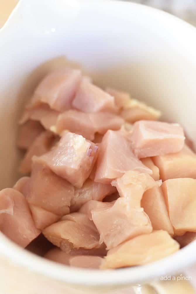 Pieces of chicken breast are cut into cubes and ready to cook for this cashew chicken recipe.
