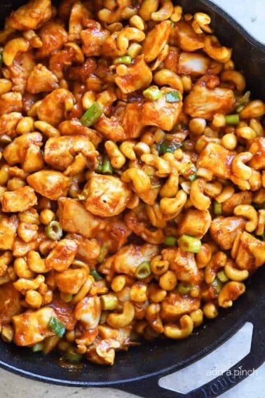 Cashew Chicken in an iron skillet.