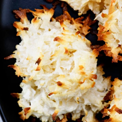 Easy Coconut Macaroons Recipe - Theseย easy coconut macaroons are made with just five ingredients. Golden brown, they are light, chewy and filled with flavorful coconut! // addapinch.com