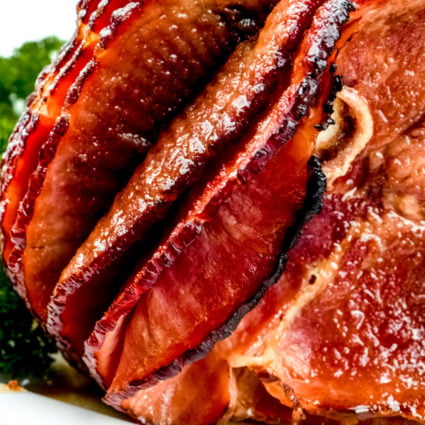 Cola Glazed Ham Recipe - This classic cola glazed hamย recipe with brown sugar makes an easy baked ham perfect for any occasion! ย // addapinch.com