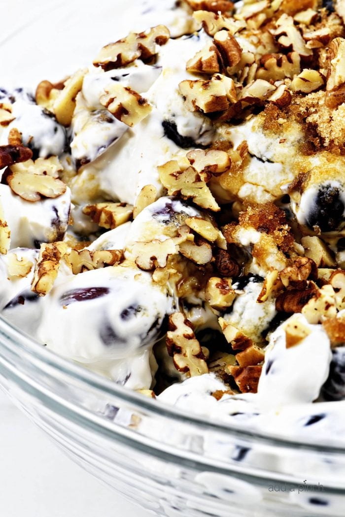 Grape salad in a glass bowl.