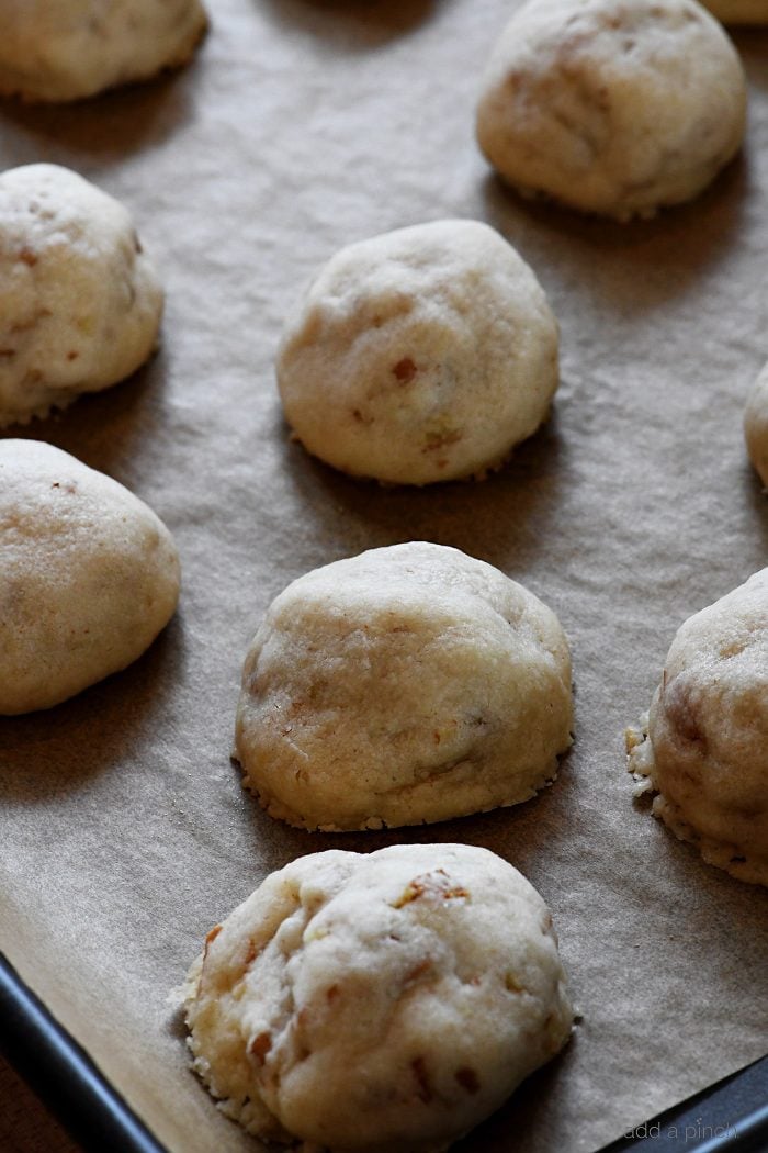 Pecan Sandies on parchment covered tray