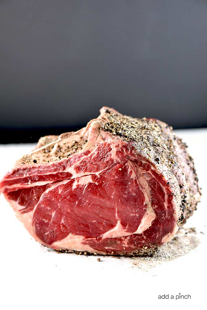 Pepper crusted standing rib roast ready to be cooked.