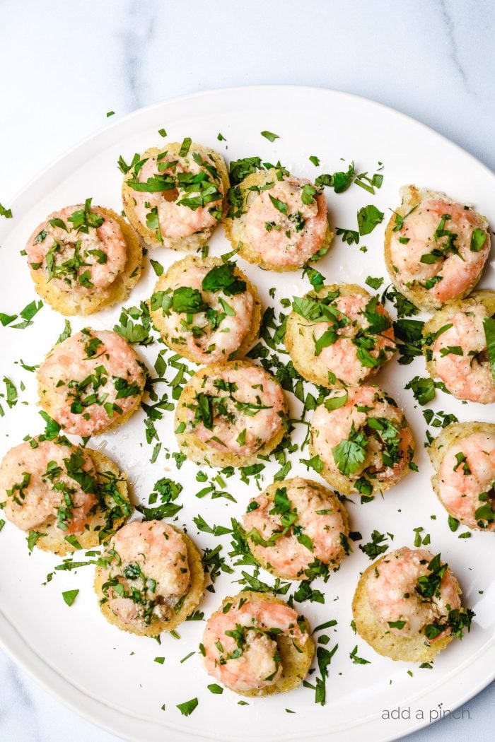 Shrimp and Grits Bites sprinkled with freshly chopped parsley.