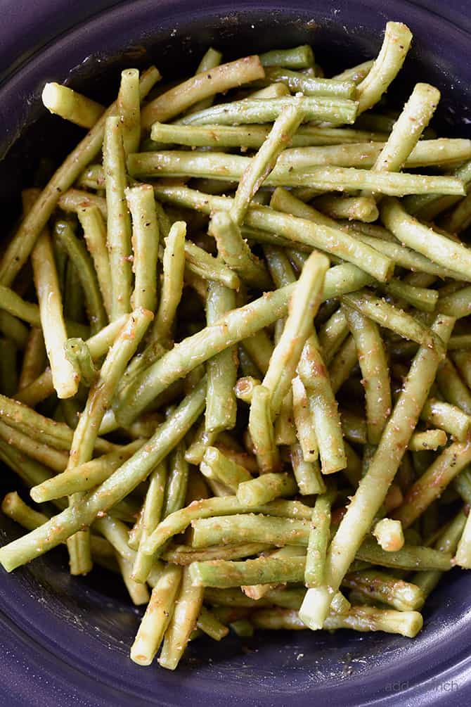 Slow Cooker Green Beans Recipe - These are the best slow cooker green beans and have everyone coming back for more! // addapinch.com