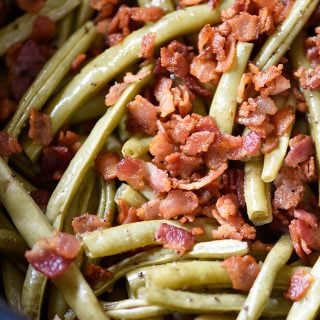 Slow Cooker Green Beans Recipe - These are the best slow cooker green beans and have everyone coming back for more!ย // addapinch.com